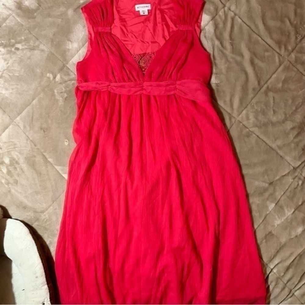 This is a maternity dress. Light summer dress perfect for any special occasion .